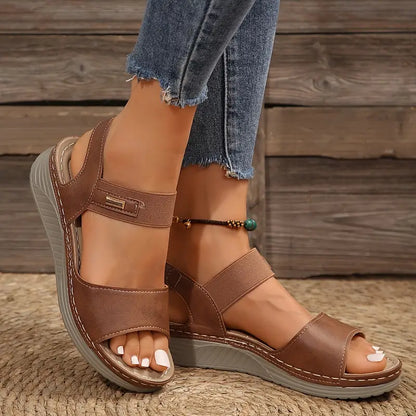 Women sandals with open toe, wedge heel and hook and loop ankle strap