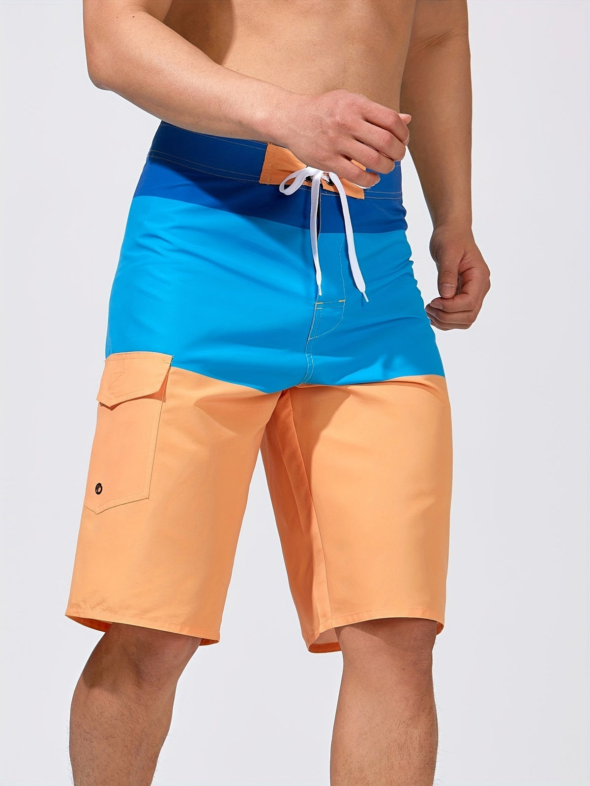 Knee-length board shorts for men with drawstring waist and flap cargo pocket