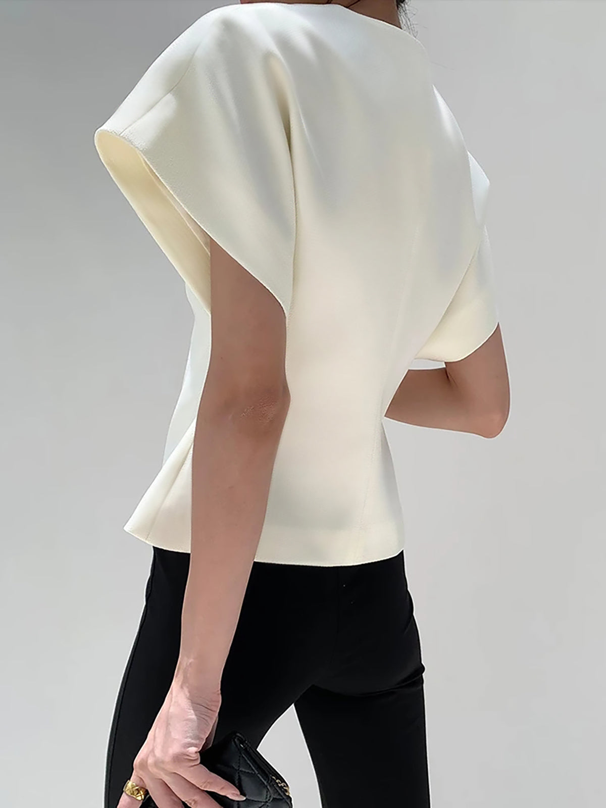 V-neck blouse for women with cap sleeves and single button fastening