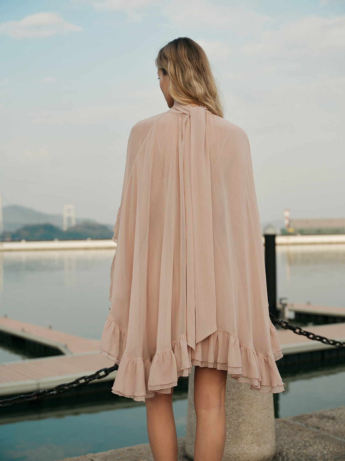 Mock neck mini dress with ruffle trim and cape overlay for women