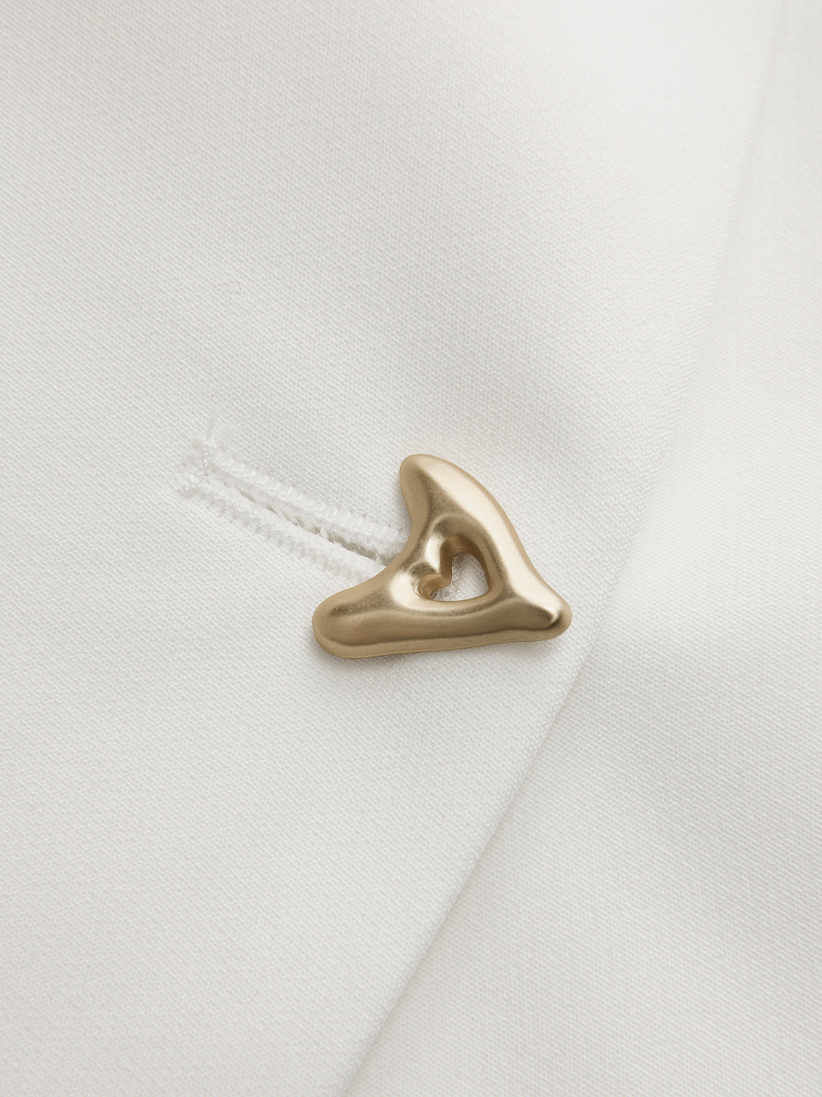 V-neck blouse for women with cap sleeves and single button fastening