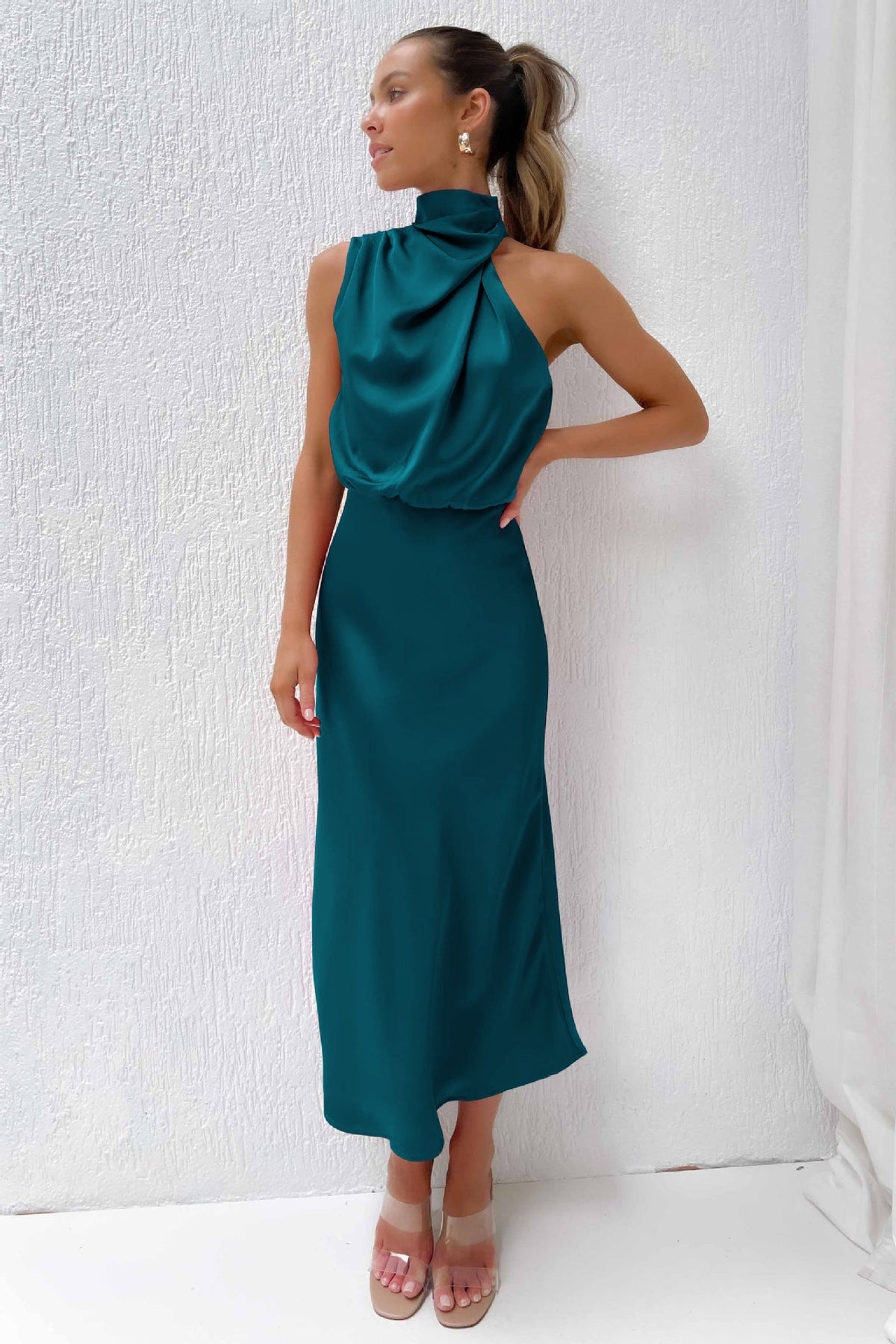 Halter neck formal dresses for women with a midi length and satin finish