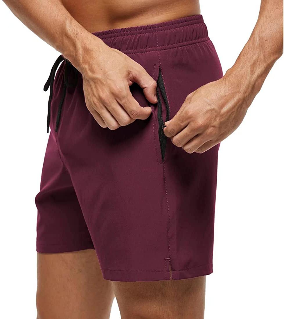 Board shorts for men with side zip pocket, hem vents and above-knee length