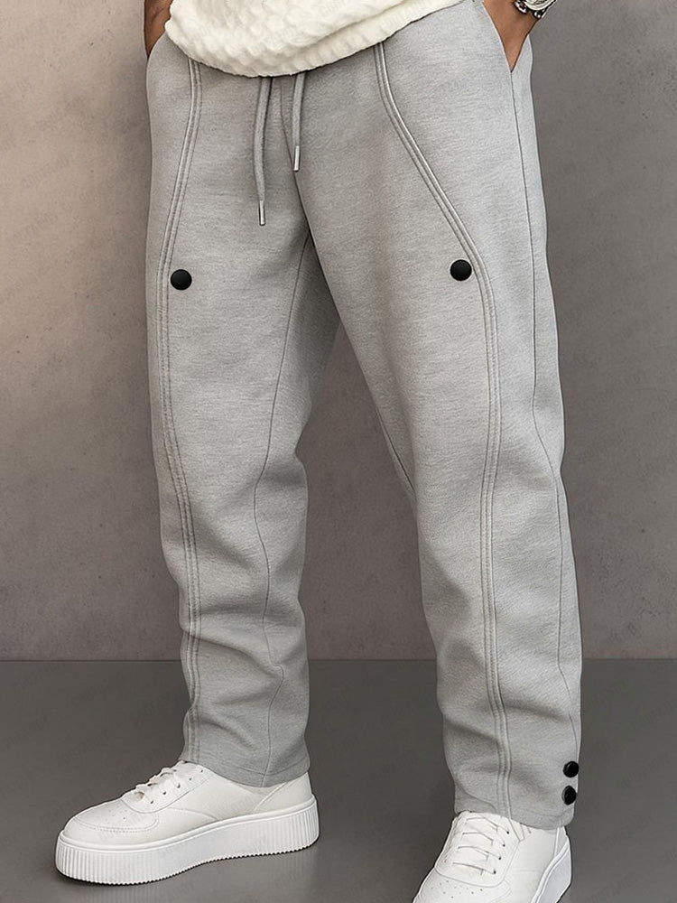 Track pants for men with drawstring waist and button hem detail