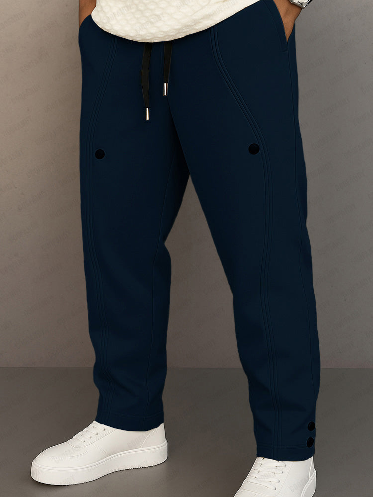 Track pants for men with drawstring waist and button hem detail