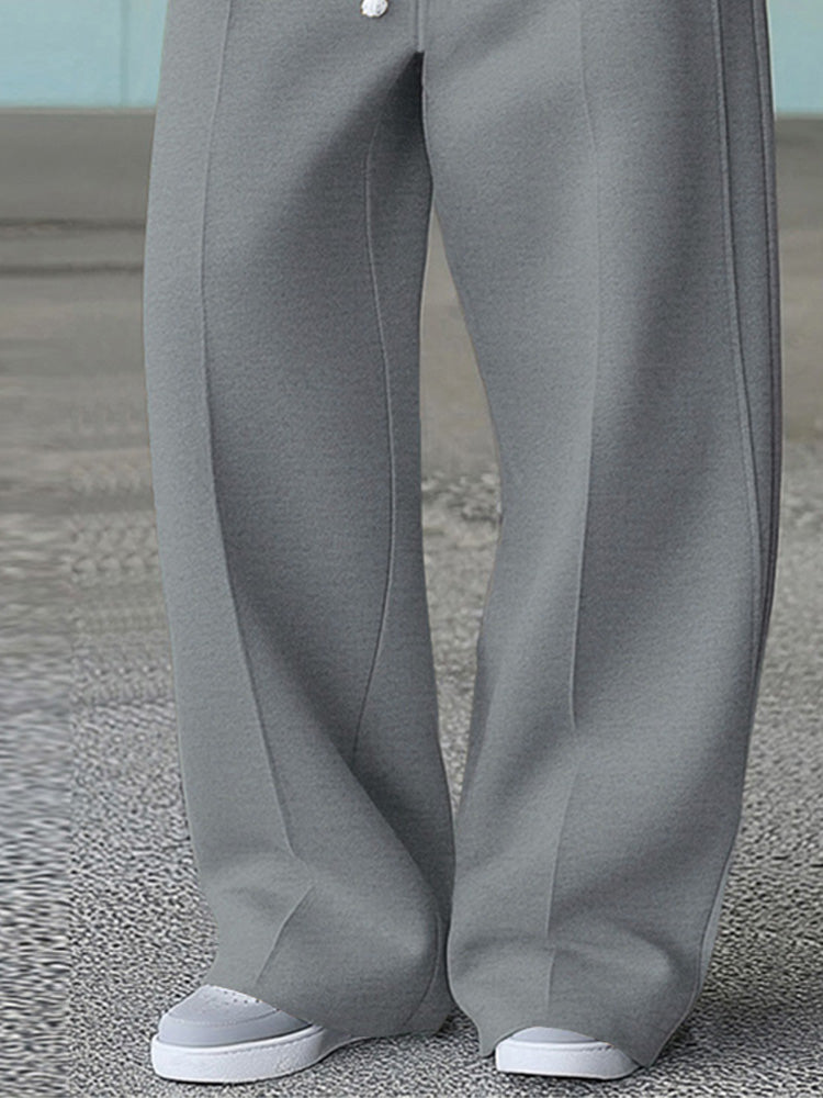 Wide leg track pants with drawstring waist and side pockets
