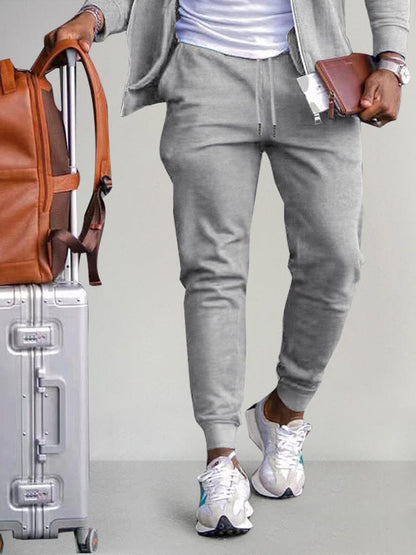 Track pants for men with drawstring waist and cuffed hems