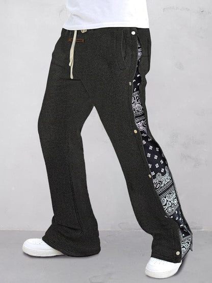 Flared track pants for men with paisley side panel and snap buttons