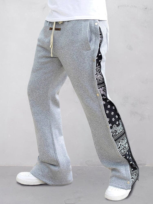 Flared track pants for men with paisley side panel and snap buttons