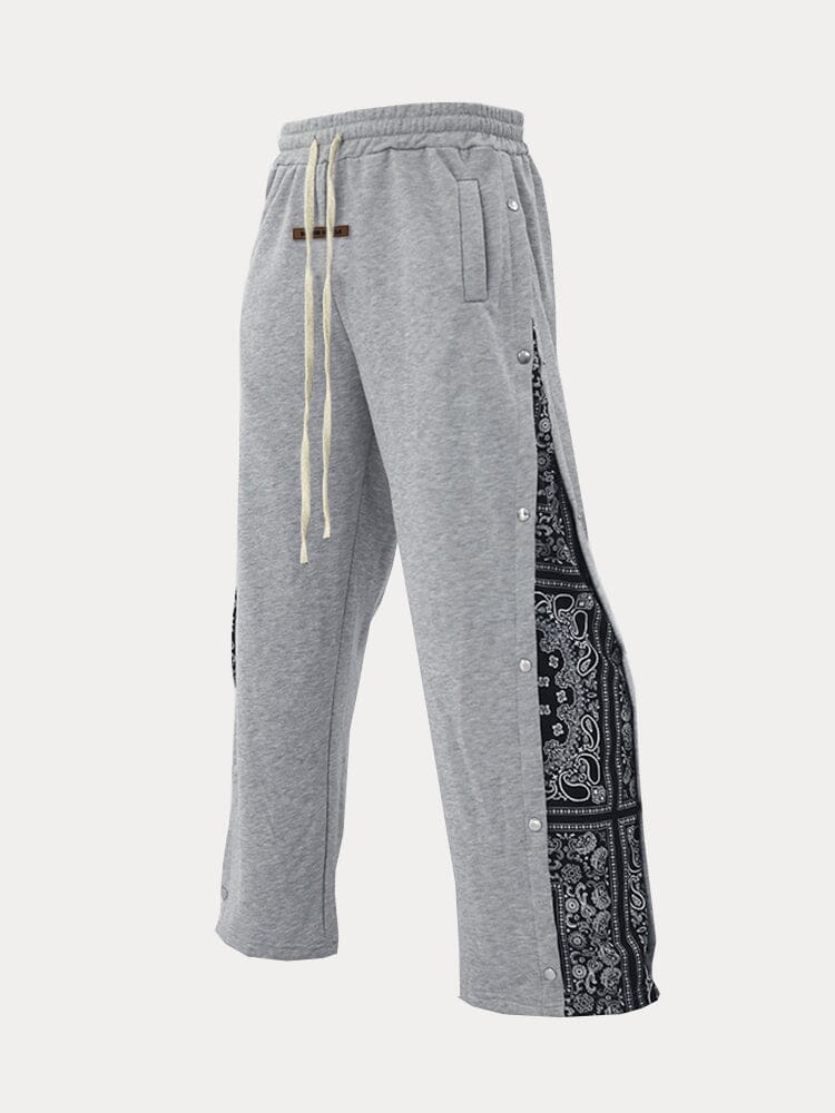 Flared track pants for men with paisley side panel and snap buttons
