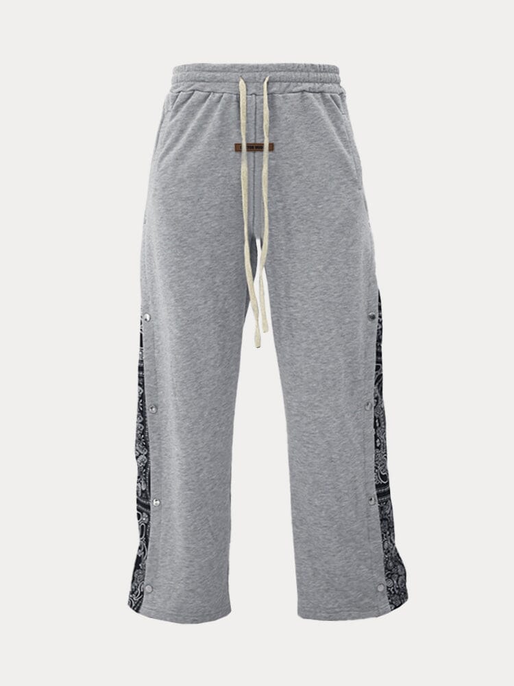 Flared track pants for men with paisley side panel and snap buttons