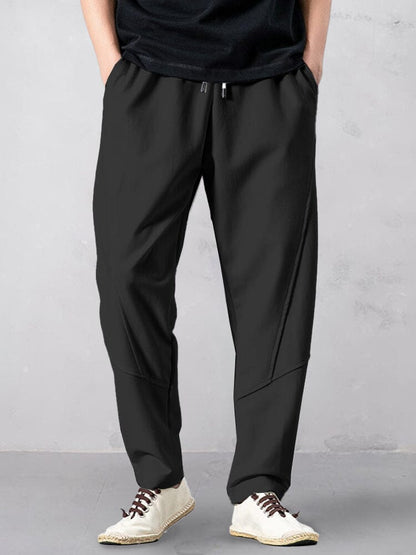 Track pants for men with tapered leg and drawstring waist