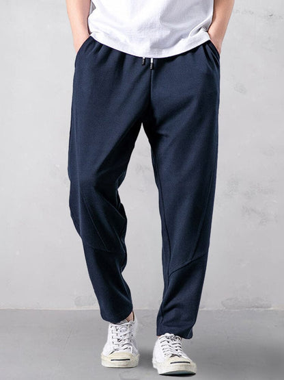 Track pants for men with tapered leg and drawstring waist