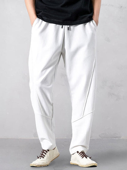 Track pants for men with tapered leg and drawstring waist
