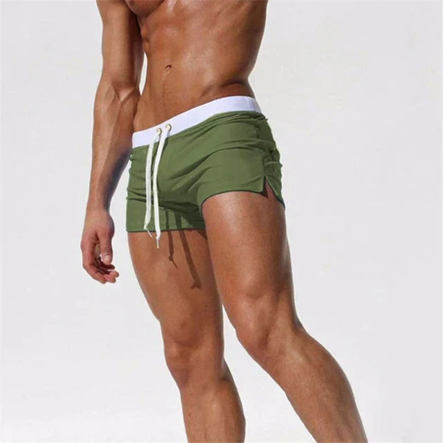 Fitted short leg board shorts for men with side split hems and zip pocket