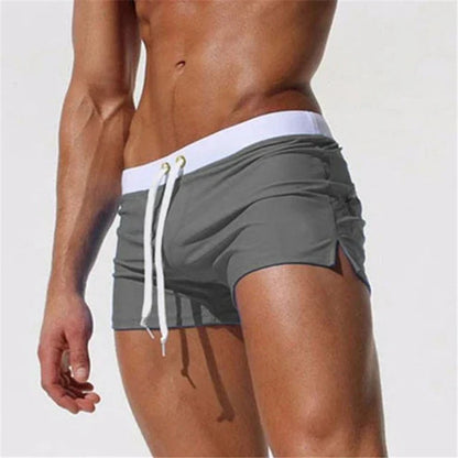 Fitted short leg board shorts for men with side split hems and zip pocket