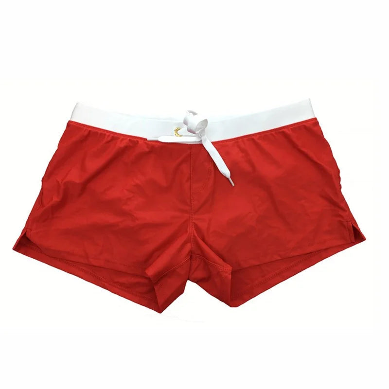 Fitted short leg board shorts for men with side split hems and zip pocket