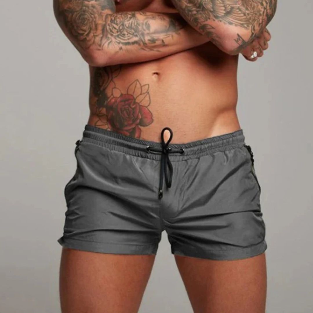Short length board shorts for men with drawstring waist and zip side pockets