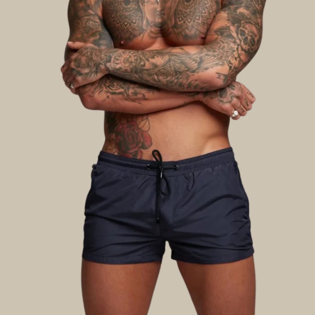Short length board shorts for men with drawstring waist and zip side pockets