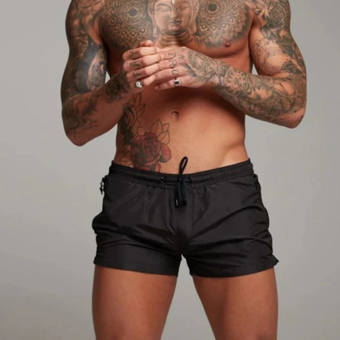 Short length board shorts for men with drawstring waist and zip side pockets